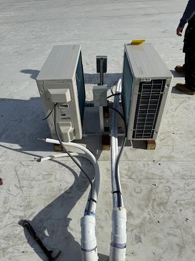 Ductless mini-split outdoor units with refrigerant lines