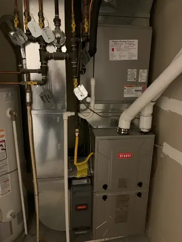 Residential Bryant gas furnace and ductwork serviced by River City Heating and Cooling