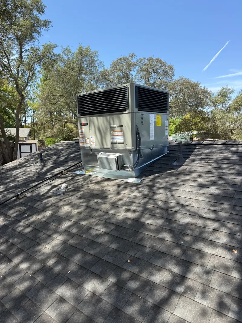 Close view of a newly installed rooftop package unit with service panels