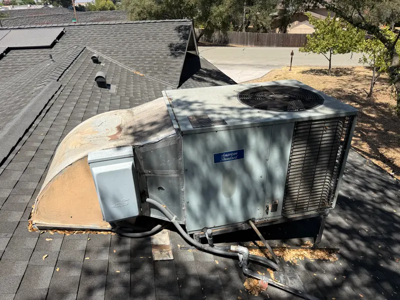 Worn rooftop package air conditioner with faded cabinet before replacement